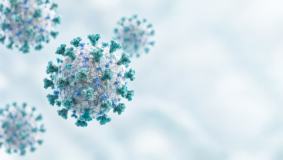 3D illustration of SARS-CoV-2 particles with spike proteins on a light blue-turquoise background, one sharp in front.